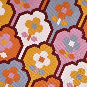 May include: A repeating pattern of geometric shapes with stylized flowers in shades of orange, pink, white, and blue. The background is a dark red.