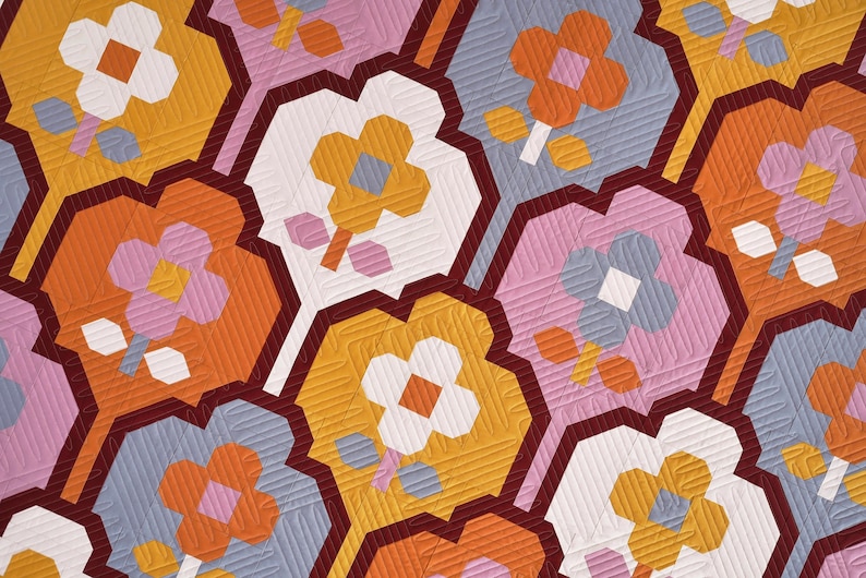 May include: A repeating pattern of geometric shapes with stylized flowers in shades of orange, pink, white, and blue. The background is a dark red.