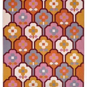 May include: A repeating pattern of stylized flowers in shades of orange, pink, white, and gray. The flowers are arranged in a geometric pattern on a white background.