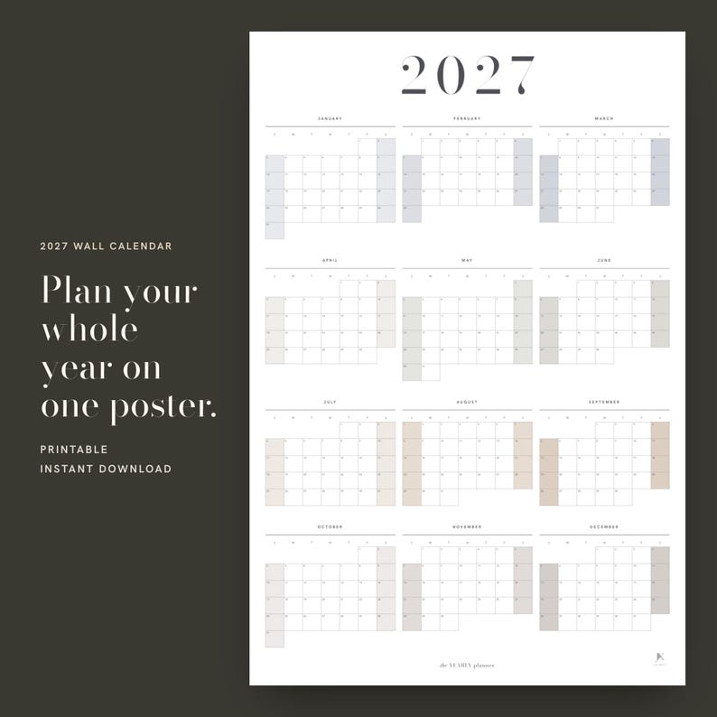 May include: A 2027 wall calendar poster featuring a twelve-month grid layout. The design includes the text 2027 at the top, with months from January to December organized in rows. The calendar displays days of the week and numerical dates.