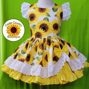 Sunflower Print Infant Baby Toddler Girls Summer Dress with eyelet trim skirt and yellow ruffled full underskirt. Birthday Pageant Dress