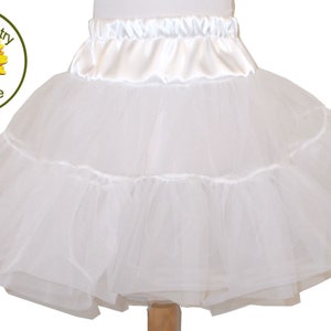 May include: White tulle petticoat with a satin waistband. The petticoat has multiple layers of tulle and a ruffled hem.