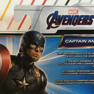 May include: A Captain America action figure from the Marvel Avengers series. The figure is wearing a blue and red costume with a star on the chest. The packaging features the Marvel Avengers logo and the text "Captain America". The text "The First Avenger, Steve Rogers stands ready when the world needs him." is also included on the packaging.