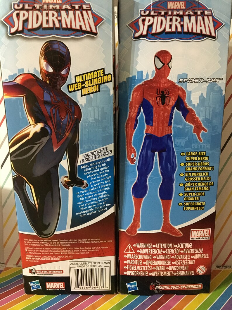 May include: Two action figures of Marvel's Spider-Man. The figure on the left is Miles Morales, wearing a red and black suit. The figure on the right is Peter Parker, wearing a red and blue suit. Both figures are posed in action poses. The boxes feature the Marvel logo and the words "Ultimate Spider-Man".