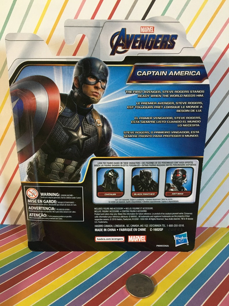 May include: Captain America action figure from the Marvel Avengers series. The figure is wearing a blue and red costume with a star on the chest. The packaging includes a quote about Captain America being ready when the world needs him. The back of the package shows other figures in the series, including Black Panther, Ant-Man, and Chitauri.
