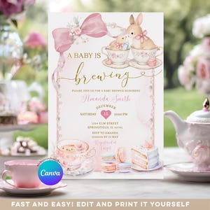 May include: A baby shower invitation with a pink and gold theme. The invitation features a pink bow, bunny illustrations, and the text "A Baby is Brewing". The invitation includes details for Amanda Smith's baby shower.