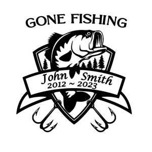 May include: Black and white illustration of a bass fish jumping out of the water with a fishing hook in its mouth. The fish is surrounded by a shield with trees and a banner that reads "John Smith 2012 - 2023". The text "Gone Fishing" is above the shield.
