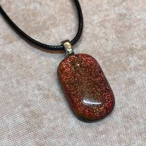 Gorgeous warm orange dichroic glass pendant, hung on a 18&quot; vegan waxed cord with silver plate lobster clasp