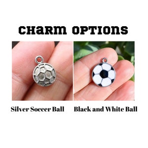 charm options are a silver soccer ball or black and white soccer ball