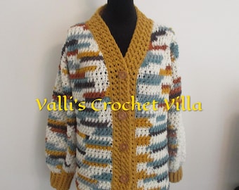 May include: A crocheted cardigan with a striped pattern in shades of brown, blue, white, and yellow. The cardigan has a V-neck and button closure. The text "Valli's Crochet Villa" is visible on the front of the cardigan.