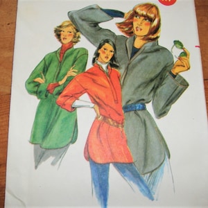 May include: Three women wearing different styles of jackets. The woman on the left is wearing a green jacket, the woman in the center is wearing a red jacket, and the woman on the right is wearing a gray jacket.