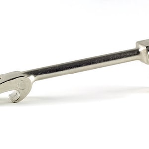 May include: A silver metal tool with a bottle opener on one end and a pointed end on the other. The tool is designed to open cans and bottles.