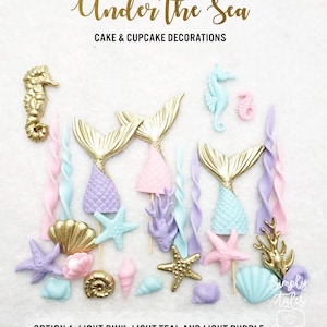 May include: Under the Sea cake and cupcake decorations in light pink, light teal, and light purple. The decorations include mermaid tails, seahorses, starfish, seashells, and coral.