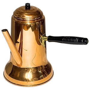 May include: A copper-colored coffee pot with a black handle and spout. The pot has a rounded base and a lid with a small black knob. The handle is attached with a brass fitting. The pot is designed for brewing coffee.