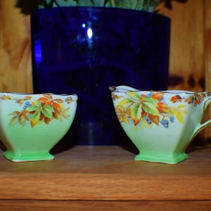 Royal Winton set, green with berries and leaves pattern, sugar bowl and cream pitcher, circa 1930&#39;s, no chips