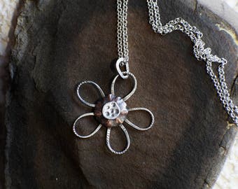 Mixed metal small 5 pedal daisy pendant on 25 inch sterling silver Rollo chain