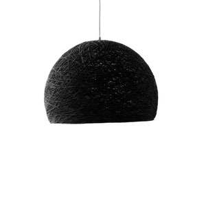 May include: Black pendant light with a woven, spherical shade.