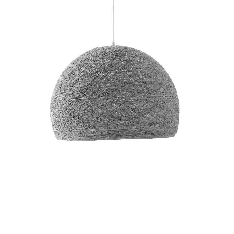 May include: A gray, round, woven pendant light fixture with a white cord.