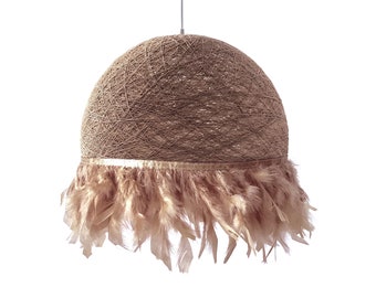 May include: A brown woven pendant light with a gold trim and a fringe of light brown feathers.