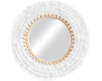 May include: White round mirror with a thick white fringe border and a natural woven rope inner frame.