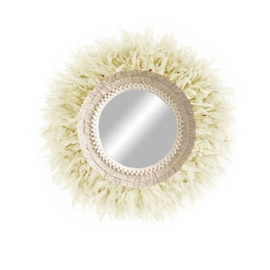 May include: A round mirror with a cream-coloured, fringed frame. The frame is made of woven rope and has a natural, bohemian style.