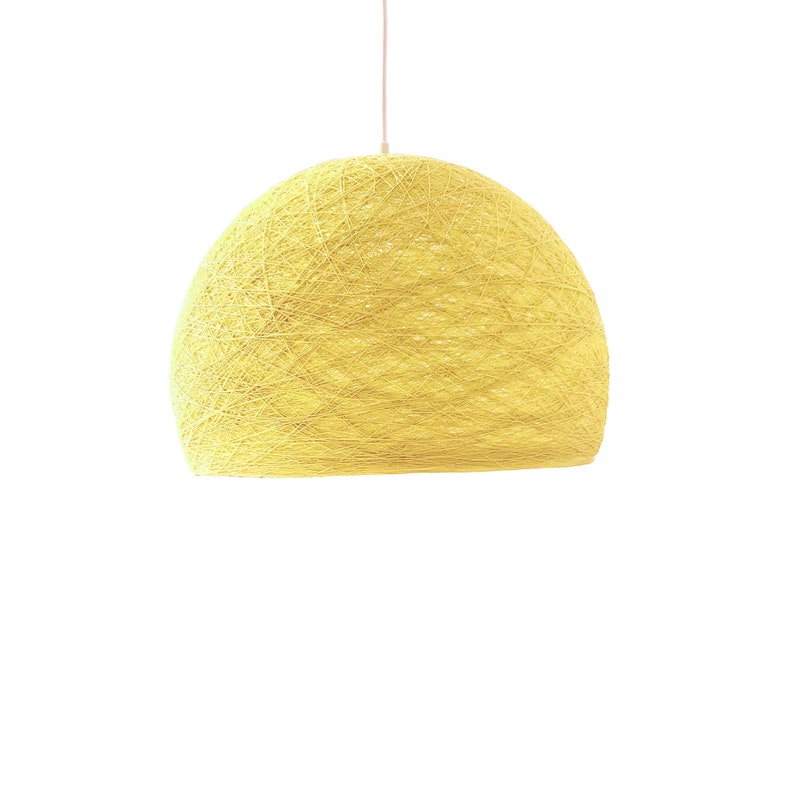 May include: A yellow, woven, dome-shaped pendant light fixture.