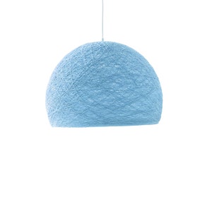 May include: A light blue pendant light made of woven string. The light is round and has a delicate, airy appearance.