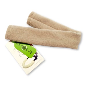 May include: Two beige fleece fabric arm warmers with a green and white tag that says "REPREVE" with a green recycling symbol and "H&SC" in white text. The tag also says "harness not included".