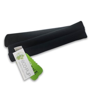 May include: Black harness strap cover with the text "eco-PUP HARNESS STRAP COVER" on a white and green tag. The strap cover is made of a soft, padded material. The product is designed for pets.