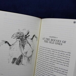 May include: A black and white illustration of a creature with a long beak and wings, from a book titled "At the Houses of the Old Ones".