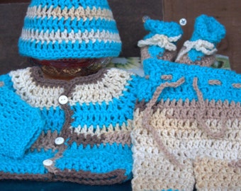May include: A crocheted baby outfit in blue, brown, and white. The outfit includes a hat, a cardigan, and pants.