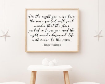 May include: A white framed print with a black and white quote about the night a baby was born. The quote reads "On the night you were born, the moon smiled with such wonder that the stars peeked in to see you and the night wind whispered, life will never be the same." - Nancy Tillman