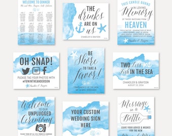 May include: Set of nine watercolor wedding signs with a beach theme. The signs feature blue and white watercolor backgrounds with nautical and beach-themed illustrations. The signs include text such as "Welcome to Dinner", "The Drinks Are On Us", "Be Shore to Take a Favor", "Two Less Fish in the Sea", "Oh Snap!", "Message in a Bottle", "Welcome to Our Unplugged Ceremony", and "Your Custom Wedding Sign Here".