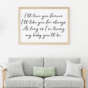 May include: A framed print with a white background and black calligraphy text that reads "I'll love you forever. I'll like you for always. As long as I'm living my baby you'll be."