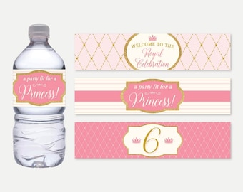 May include: Pink and gold water bottle labels with a princess theme. The labels say "a party fit for a Princess!" and "Welcome to the Royal Celebration". One label has the number 6 with a crown on each side.
