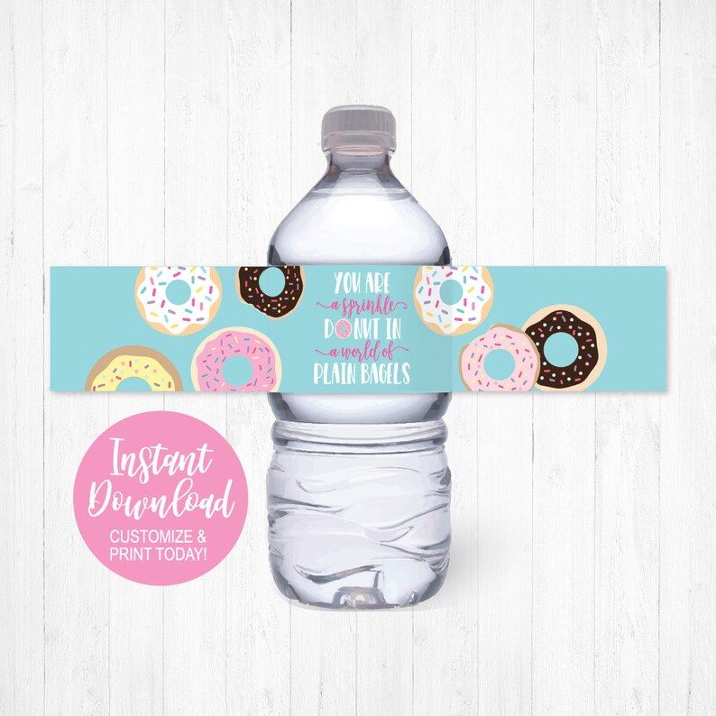 May include: Water bottle label with a blue background and colorful donuts. The text on the label reads "You are a sprinkle donut in a world of plain bagels".
