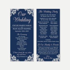 May include: A navy blue wedding invitation with white lace detailing. The invitation features the couple's names, wedding date, and a list of the wedding party members. The text "Our Wedding" is written in a decorative font.