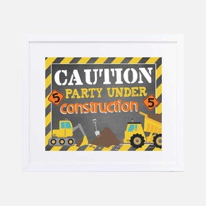 May include: A yellow and black construction themed party sign with the text "CAUTION PARTY UNDER CONSTRUCTION" and the number 5 on either side of the text. The sign features a yellow dump truck and a yellow excavator.
