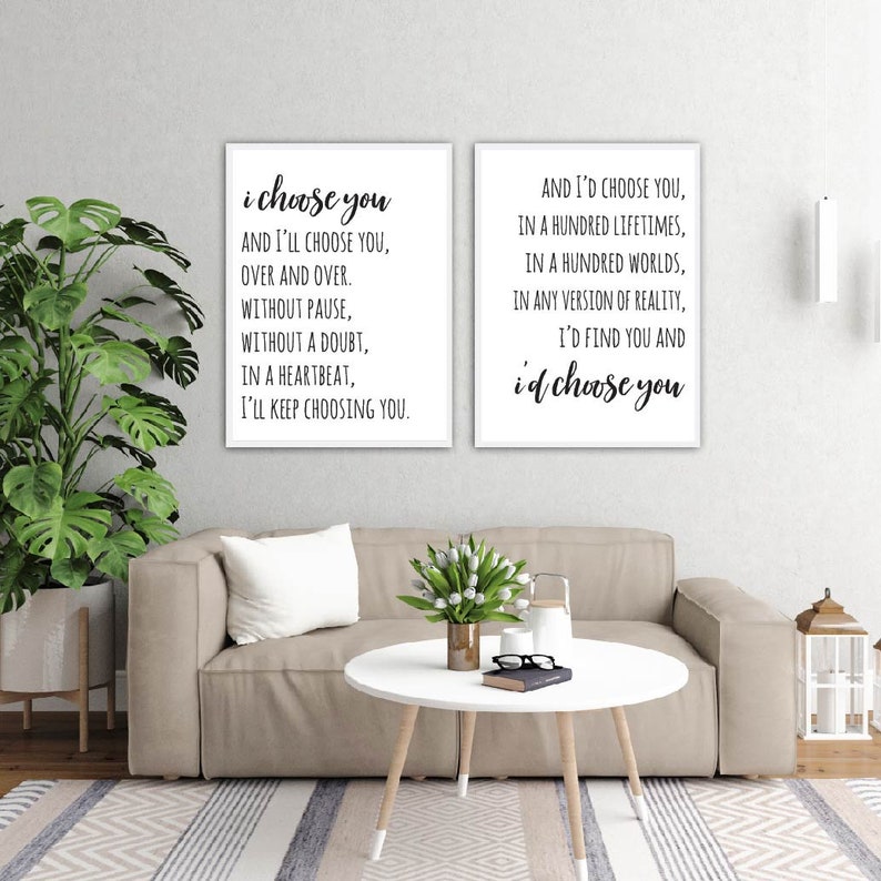 May include: Two framed prints with black text on a white background. The text on the left print reads "i choose you and I'll choose you, over and over. Without pause, without a doubt, in a heartbeat, I'll keep choosing you." The text on the right print reads "And I'd choose you, in a hundred lifetimes, in a hundred worlds, in any version of reality, I'd find you and i'd choose you."