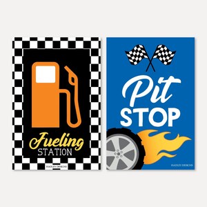 May include: Two signs for a race car themed party. The first sign has a black and white checkered background with a gas pump graphic and the text "Fueling Station". The second sign has a blue background with a tire with flames, crossed checkered flags, and the text "Pit Stop".