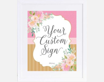 May include: A printable sign with a pink and gold floral design. The sign says "Your Custom Sign" in a gray script font.