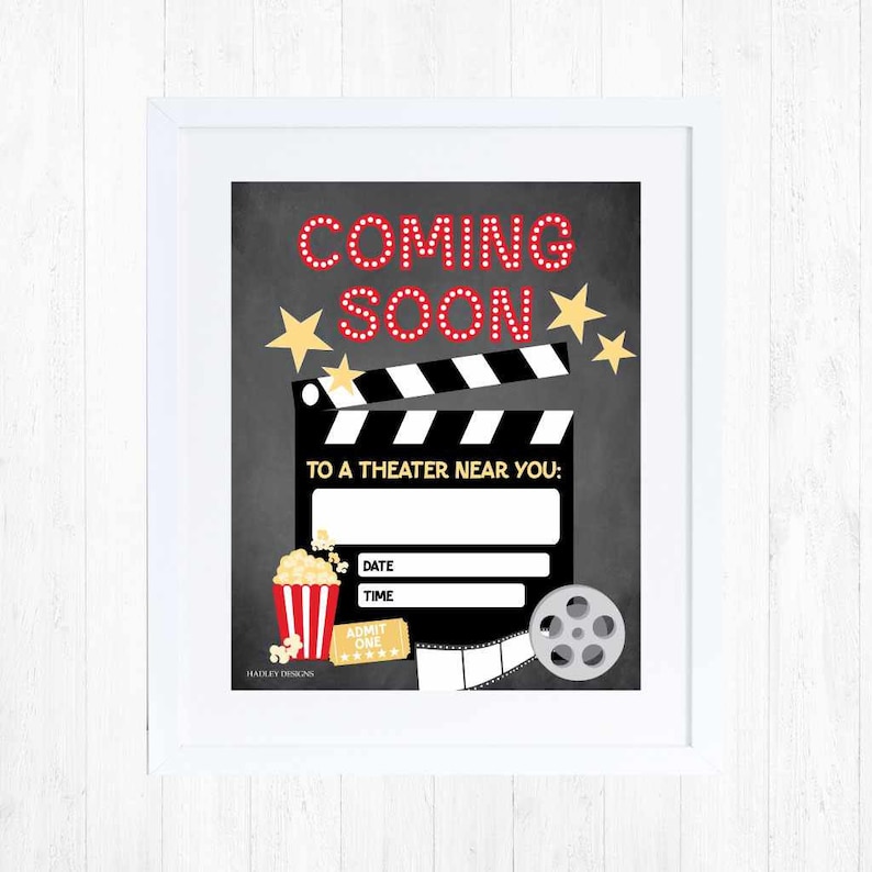 May include: A black and white chalkboard sign with the text "Coming Soon" in red letters. The sign also features a movie clapperboard, a popcorn bucket, a movie ticket, and a film reel. The text "To a Theater Near You" is written below the clapperboard. The sign also includes the words "Date" and "Time" with blank lines for filling in the information.