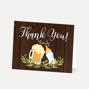 May include: Thank You! card with a woodgrain background. A beer mug and a baby bottle are shown with a green leafy garland around them.