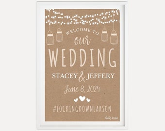 May include: A rustic brown wedding sign with white text that reads "Welcome to our Wedding Stacey & Jeffery June 8, 2024 #LockingDownLarson". The sign features a string of lights and mason jars.