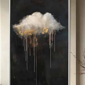 Peut inclure: Grande peinture abstraite représentant un nuage blanc avec des touches dorées sur fond sombre. Des gouttes dorées émanent du nuage. L'œuvre, encadrée de blanc, est exposée dans un intérieur moderne.