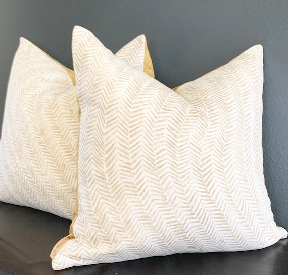 white and gold throw pillows