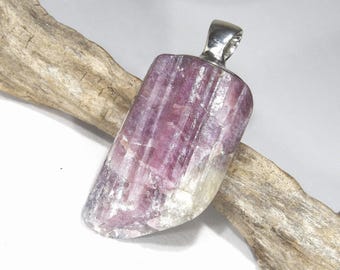 Pink rubellite tourmaline pendant in 925 silver as a raw stone with flame backing