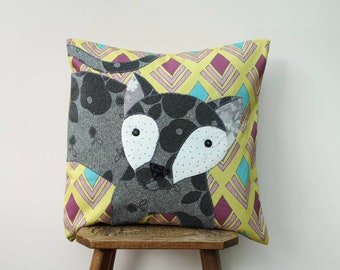Cat cushion cover handmade with appliqué using a variety of fabrics.