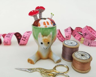 Cat pin cushion made in an upcycled eggcup, gift for sewers, quirky pin cushion, novelty pincushion, with toadstool pins