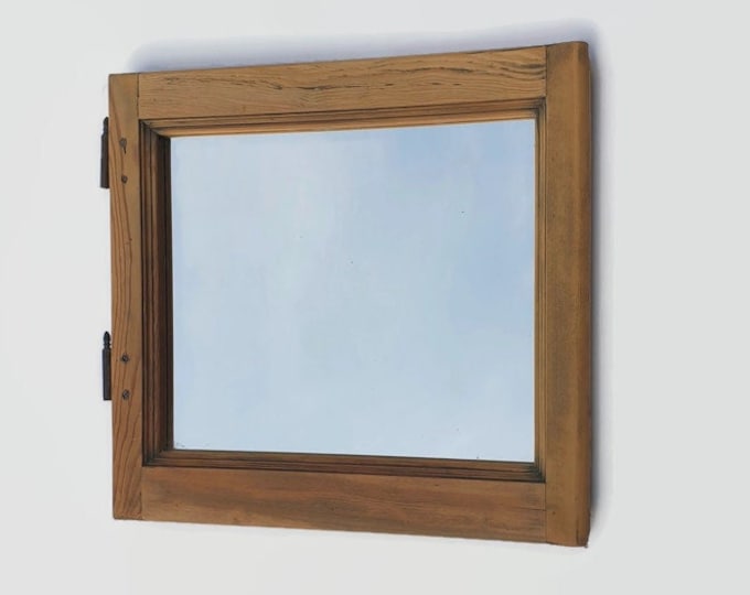 framed wall mirror made with an old wooden window